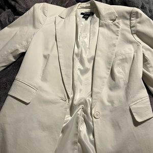 White jacket, body by Victoria’s Secret